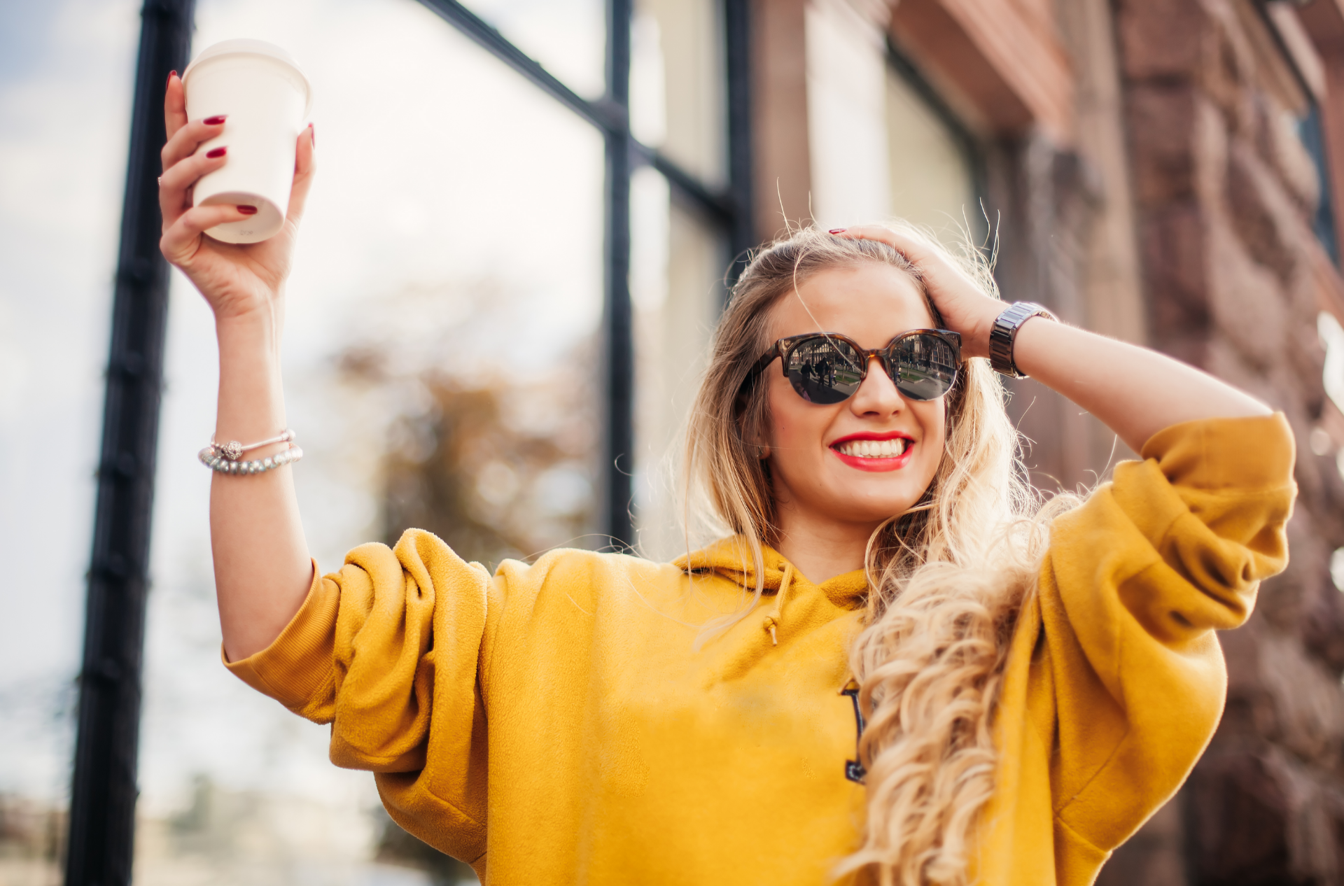smiling with coffee girl drinking coffee with Invisalign aligners