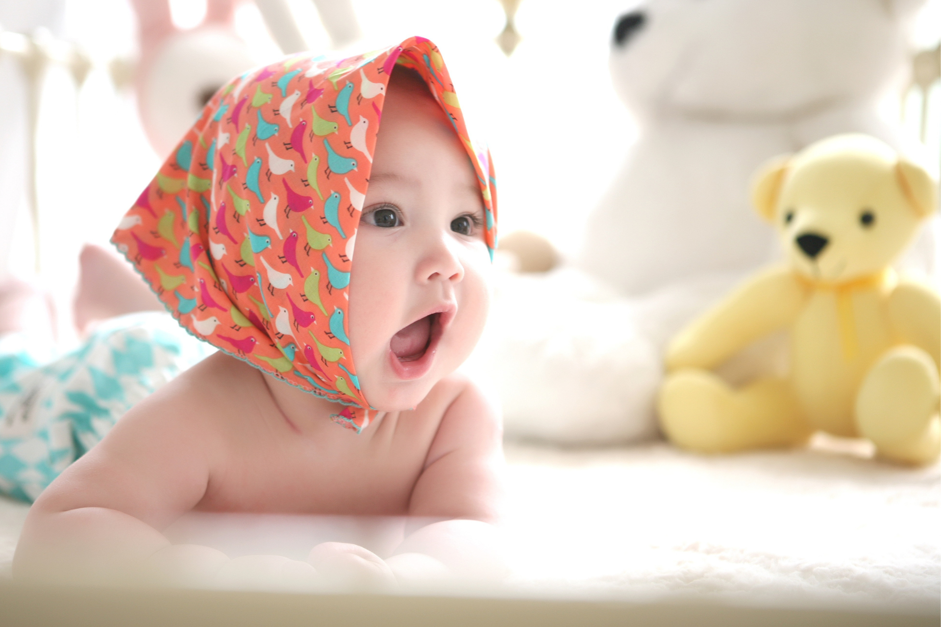 cute baby with bear toy adorable baby with a yellow bear