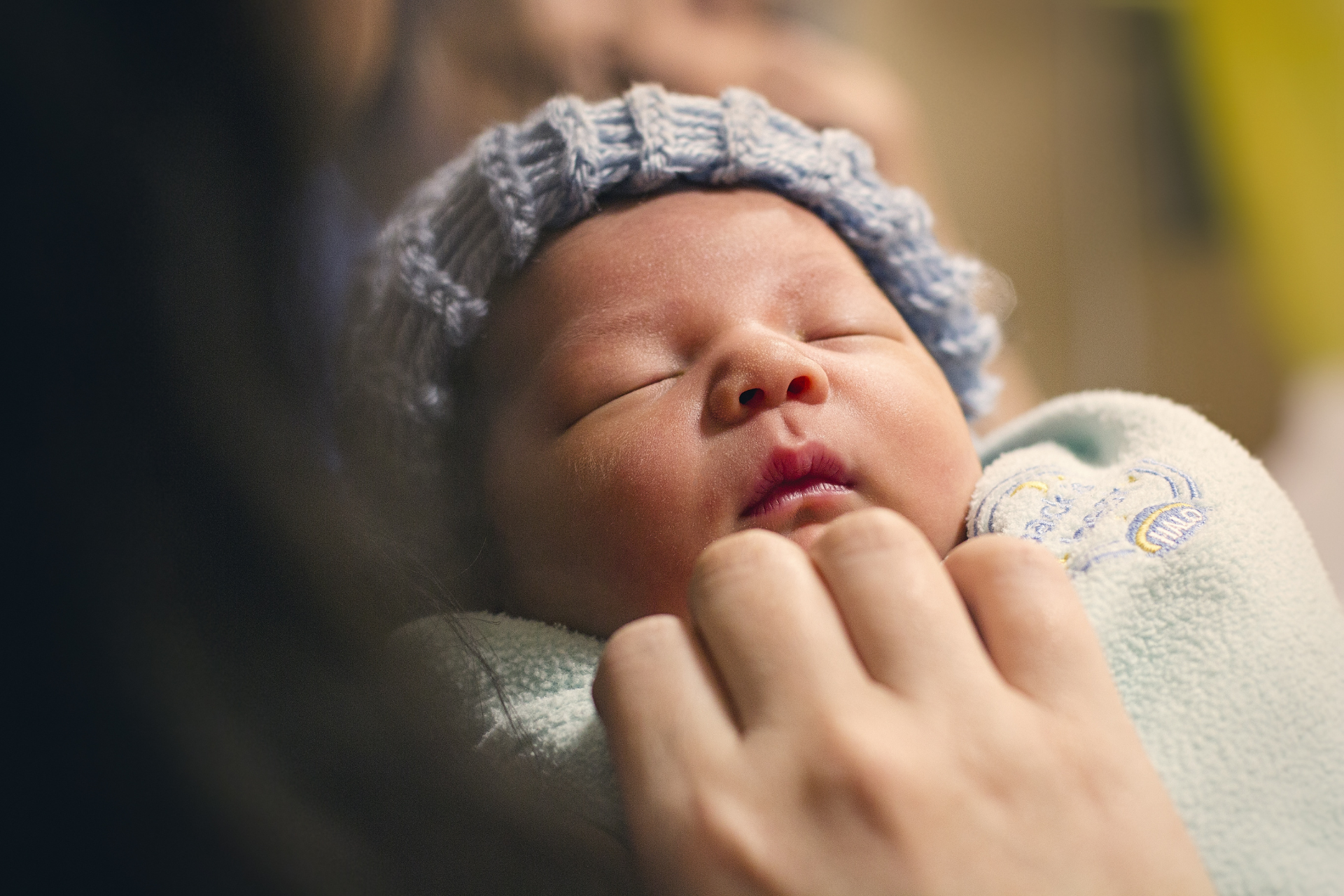 little baby with hat little baby with blue knit hat